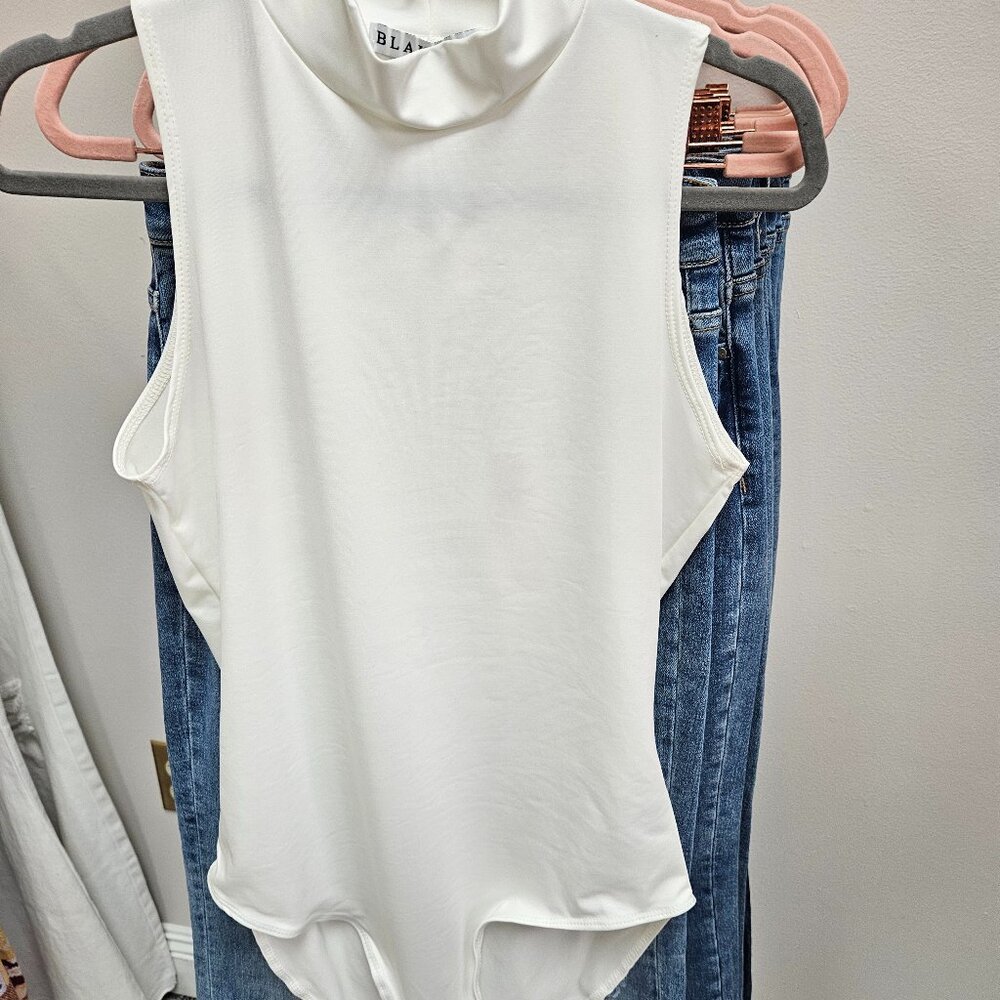 White mock neck bodysuit by Blakely
